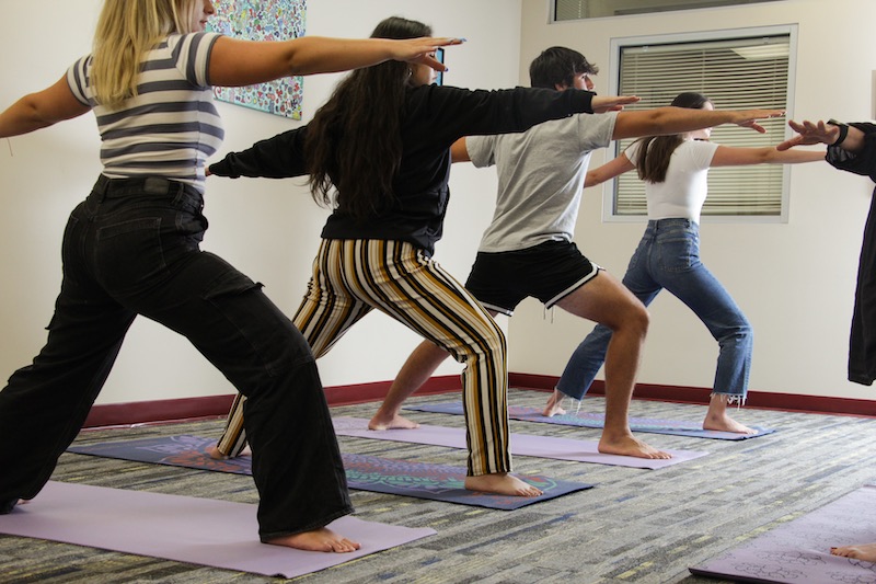 Four students in a body yoga class