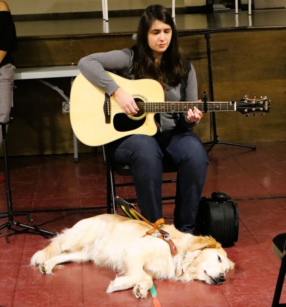 Guitar player with dog